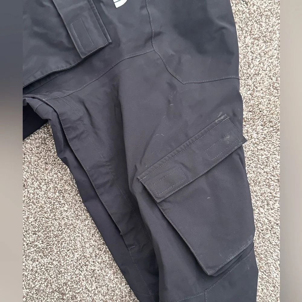 The North Face Black Hooded Raincoat with Multiple Front Pockets